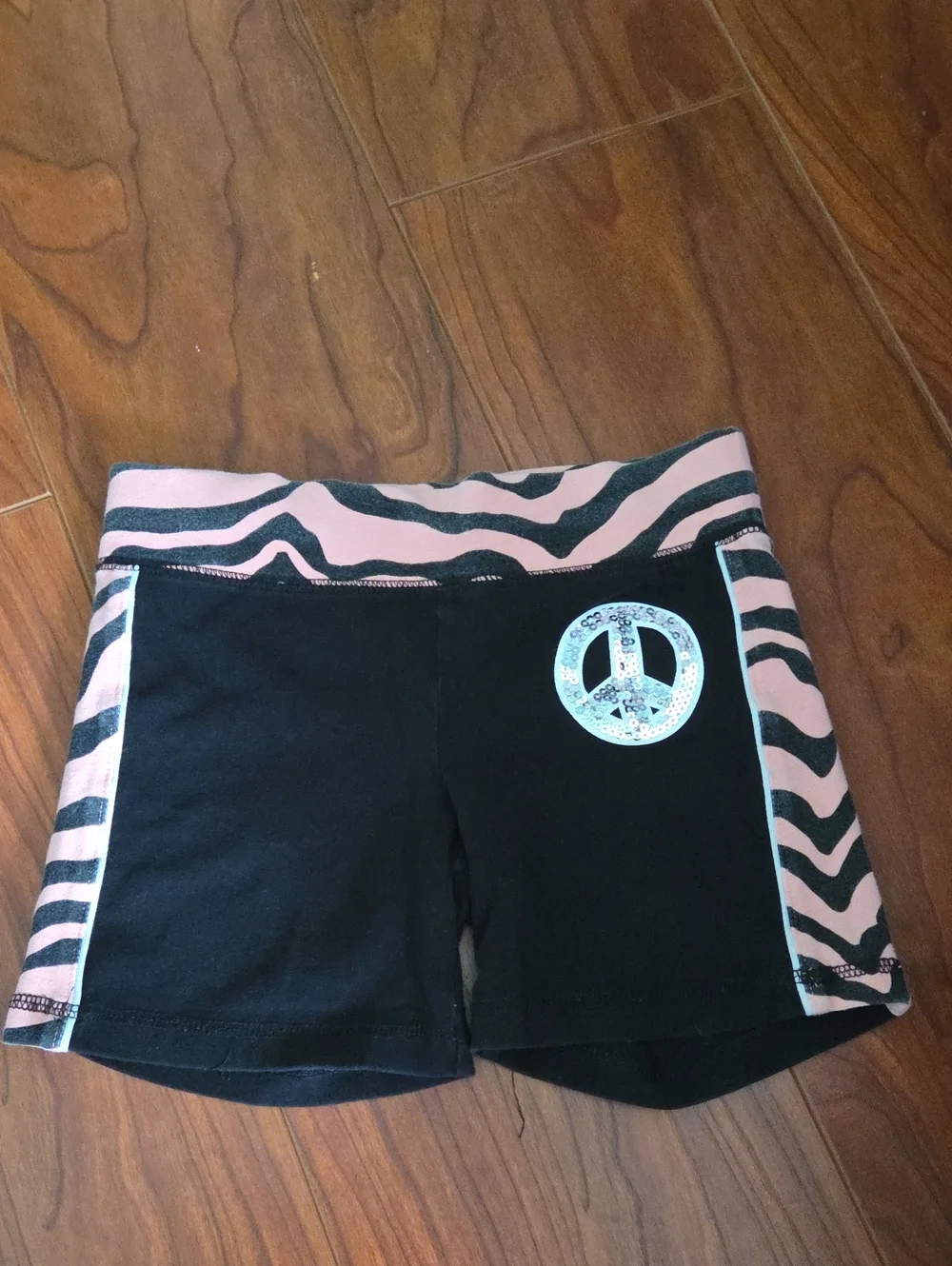 Justice Cotton Black Shorts with Pink Zebra Trim and Sequin Peace Patch